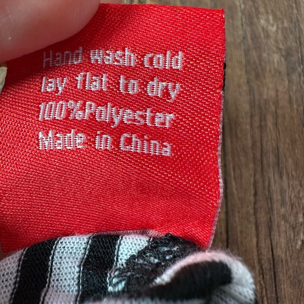 Black and White Striped Dog Onesie with Red Accents